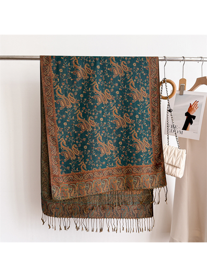 Deep teal paisley scarf displayed flat with its rectangular border and fringe visible