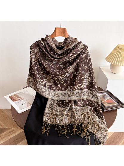 Chocolate brown paisley scarf draped on a display form with fringed ends