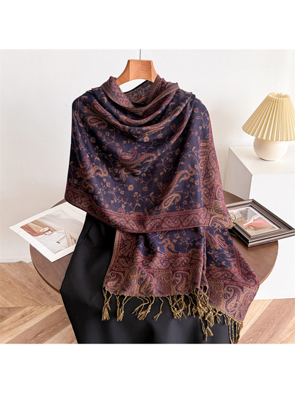 Eggplant purple paisley scarf draped on a display form with fringed ends