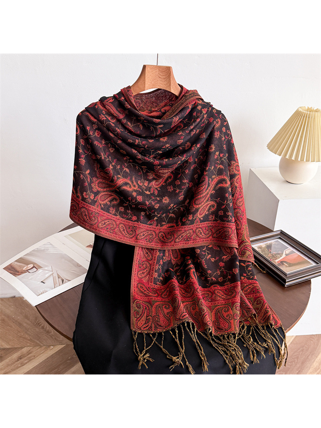 Charcoal black paisley scarf with vivid red patterning and fringed ends