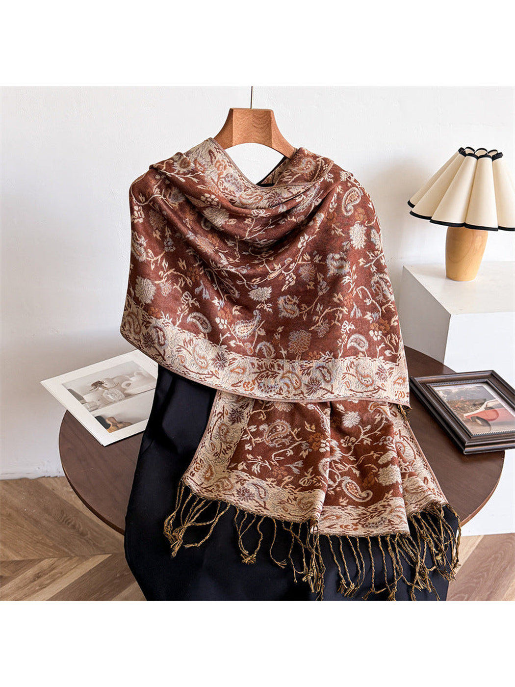 Caramel brown paisley scarf draped to show the ornamental border and twisted fringe