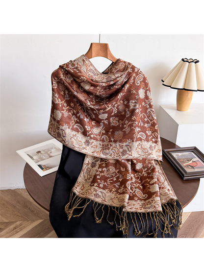 Caramel brown paisley scarf draped to show the ornamental border and twisted fringe