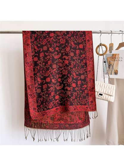 Black and red paisley scarf displayed flat with ornamental border and fringe