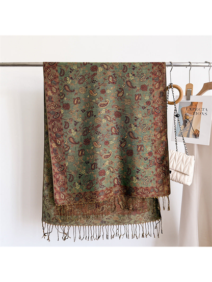 Sage green paisley scarf displayed flat with a muted rose border and fringe