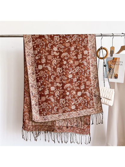 Caramel brown paisley scarf displayed flat with a cream border and twisted fringe