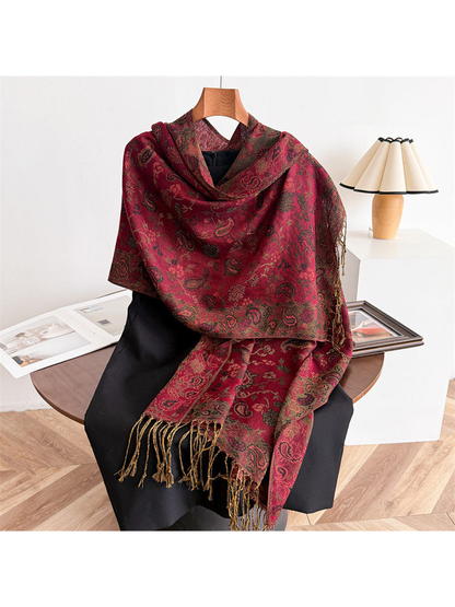 Burgundy paisley scarf draped to show the muted ornamental border and fringe