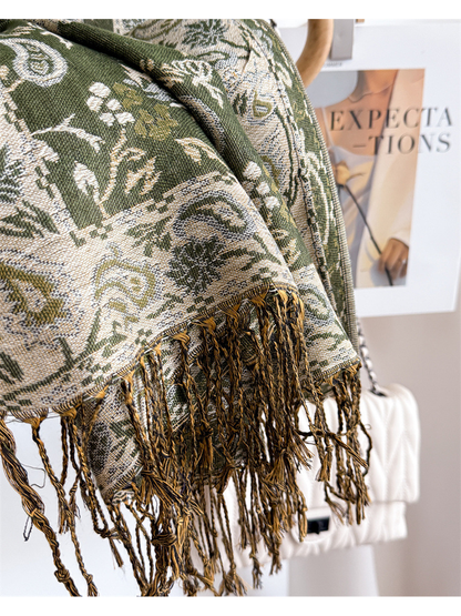 Close-up of the cream ornamental border and knotted twisted fringe