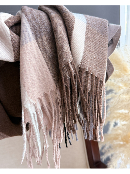 Close-up of the plaid scarf's twisted fringe and woven edge