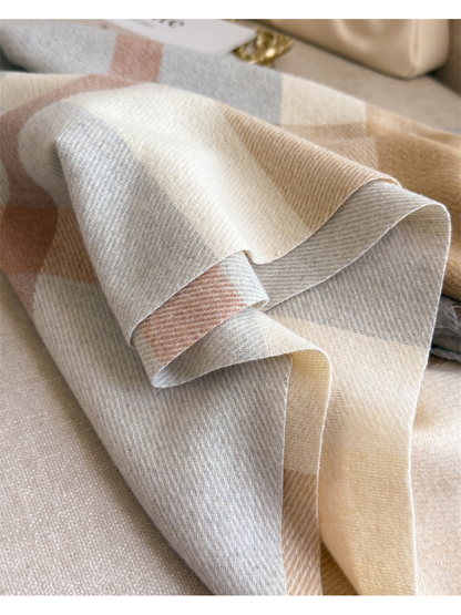 Close-up of the plaid scarf's folded edge and fine weave