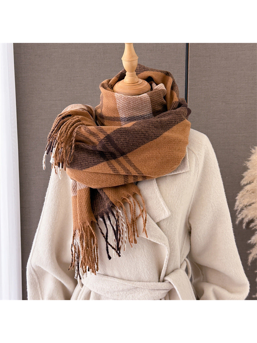 Camel plaid scarf wrapped in a voluminous layered style