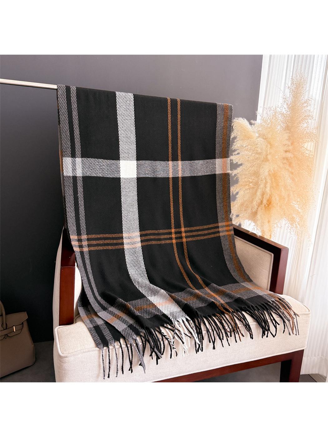 Black plaid scarf displayed full length with gray, ivory and camel stripes