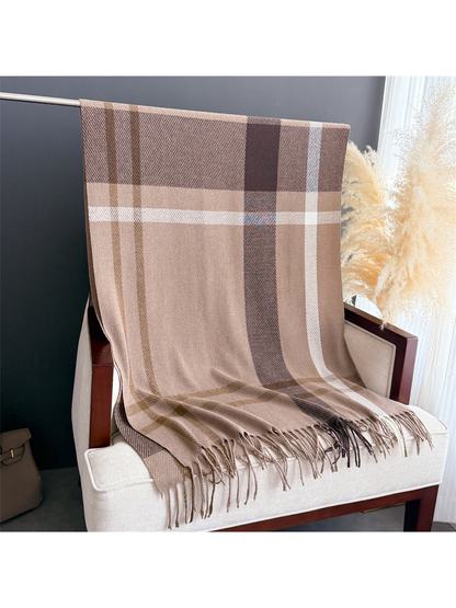Brown plaid rectangular scarf with fringe draped over a chair