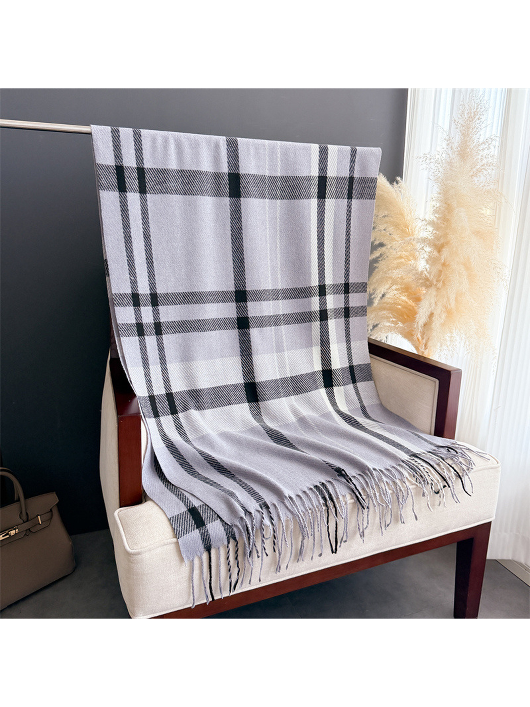 Light gray plaid rectangular scarf displayed flat with fringed ends