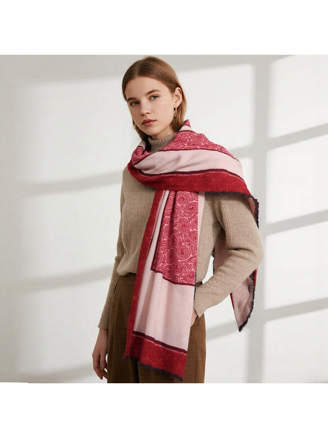 Red and blush paisley scarf draped across the shoulders