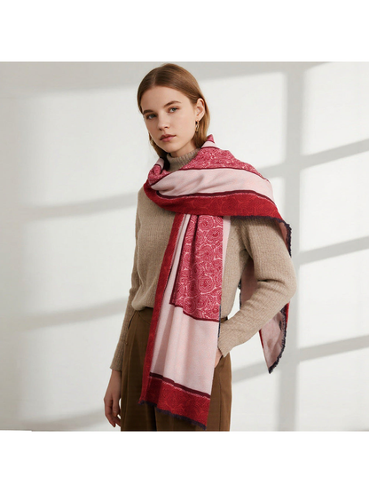 Red and blush paisley scarf draped across the shoulders