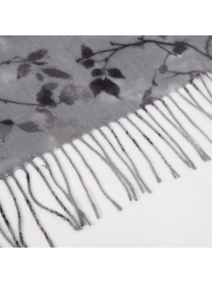 Close-up of the floral scarf edge with long twisted fringe