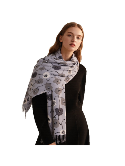 Light gray floral scarf wrapped across the shoulders with a fringed end