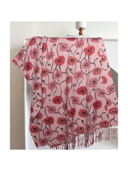 Light pink floral rectangular scarf with long fringe, draped display