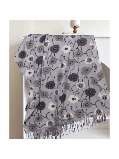 Light gray floral rectangular scarf with long fringe, draped display