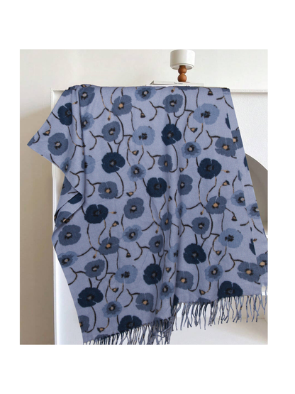 Light blue floral rectangular scarf with long fringe, draped display