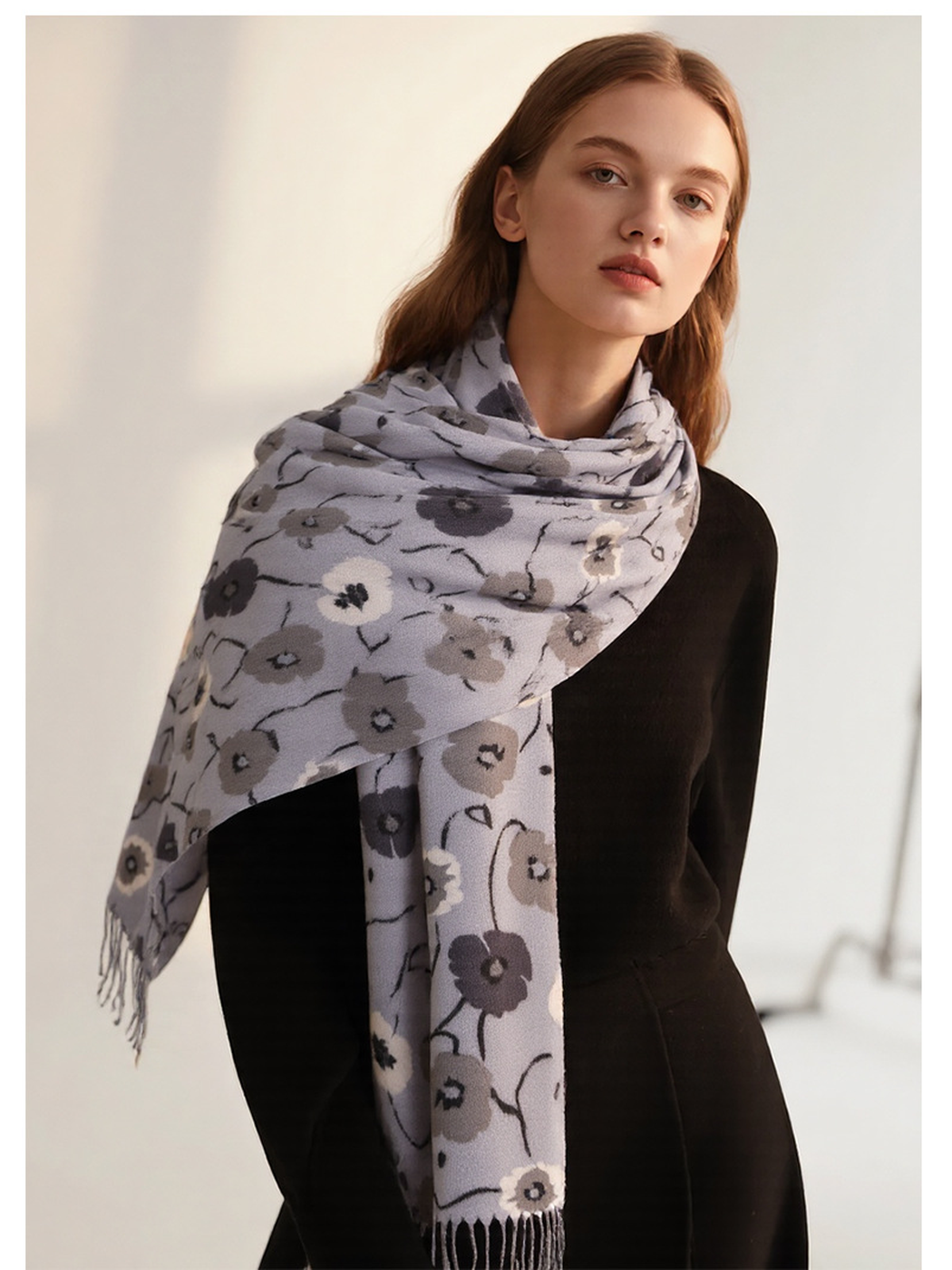 Light gray floral scarf wrapped across the shoulders with fringed ends