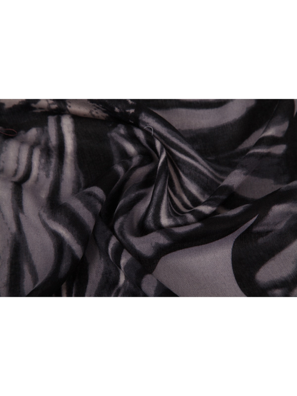 Close-up of the black and gray floral scarf gathered into soft folds