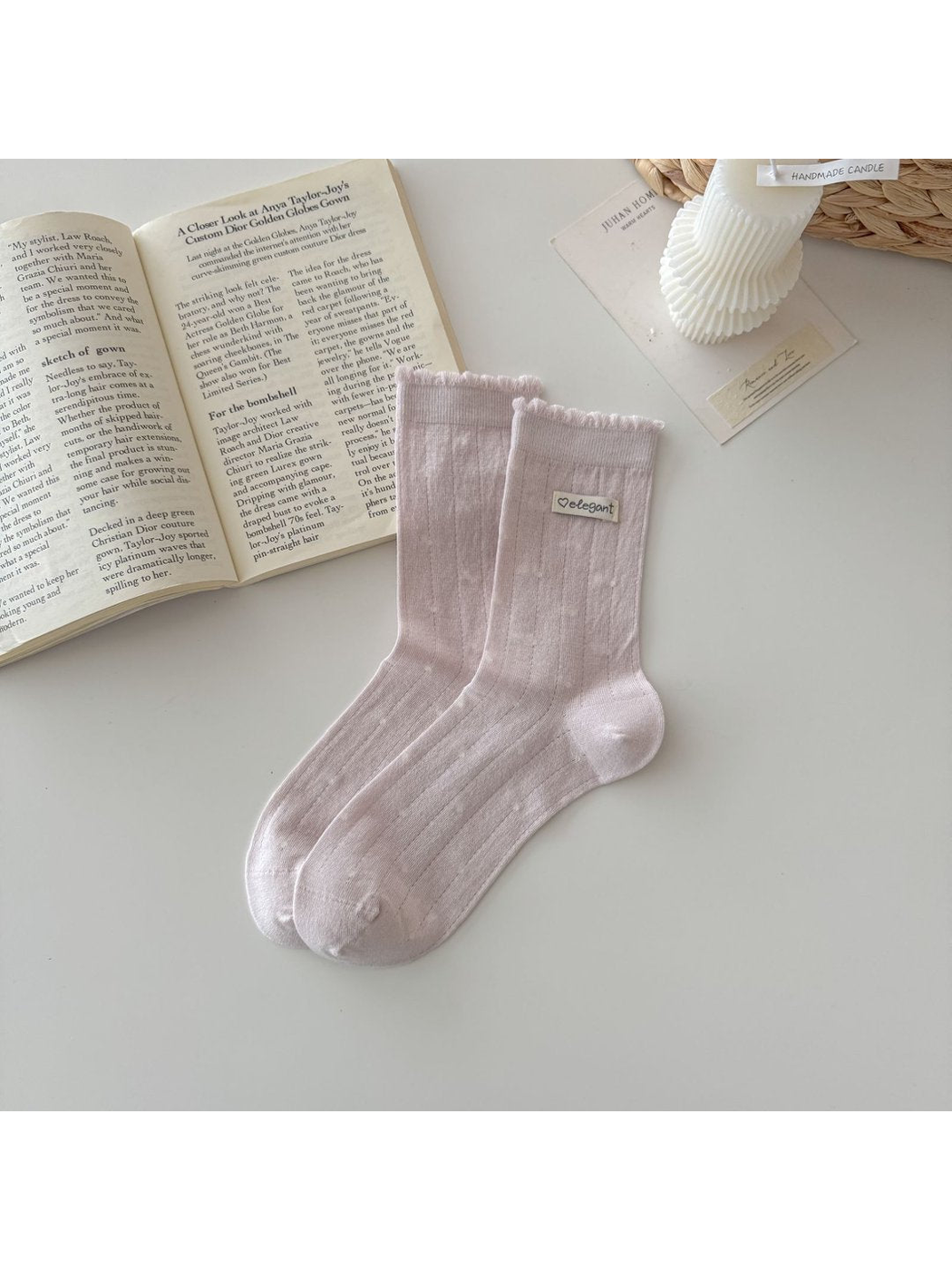 Light pink pointelle socks with ruffled cuffs and small label