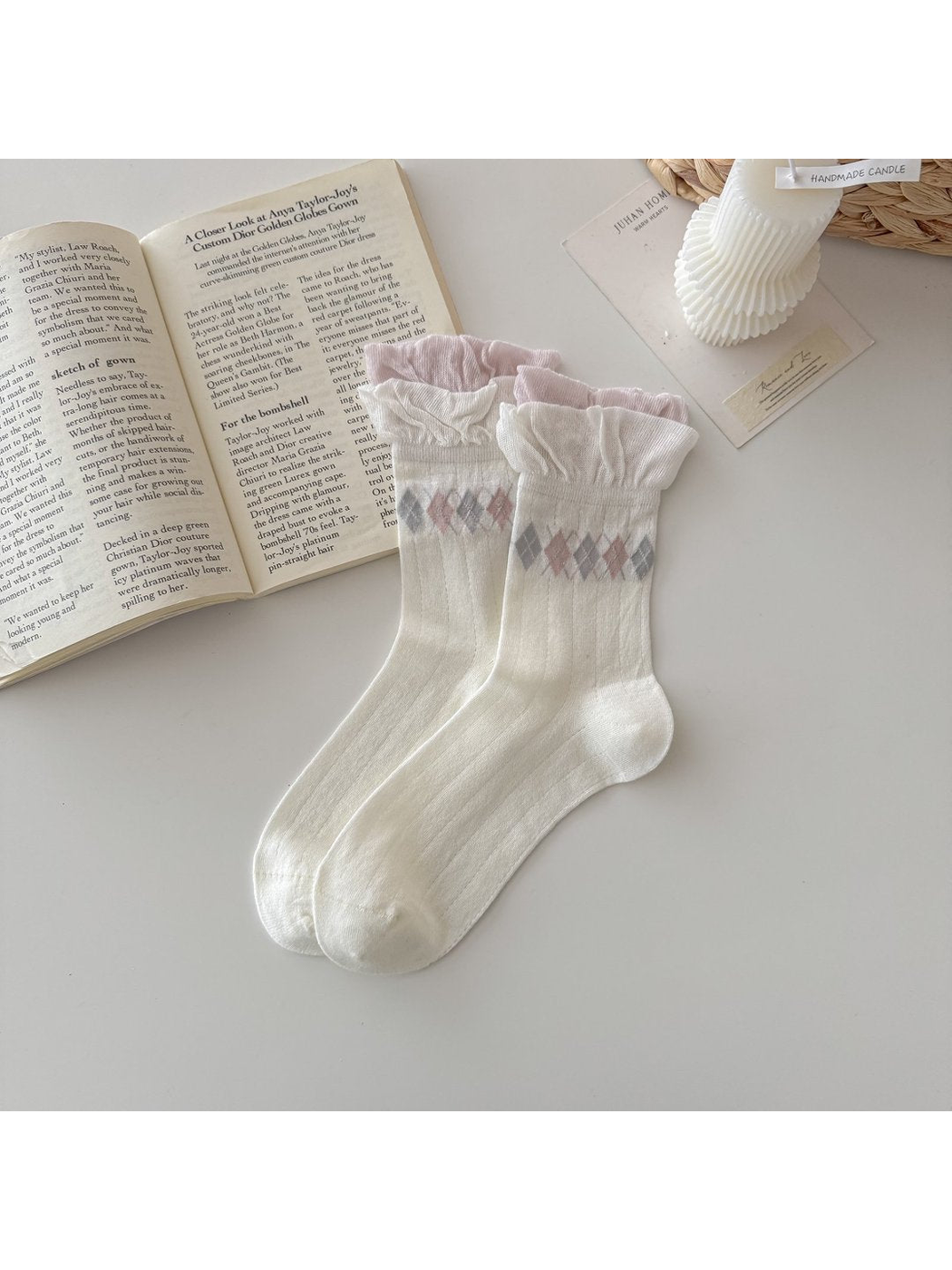 Ivory socks with ruffled cuffs and pink-and-gray argyle bands