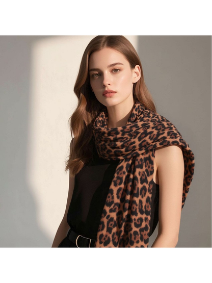 Camel leopard-print scarf wrapped around the neck and draped over one shoulder