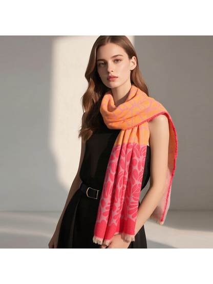 Orange and red floral scarf styled around the neck with one end draped down the front