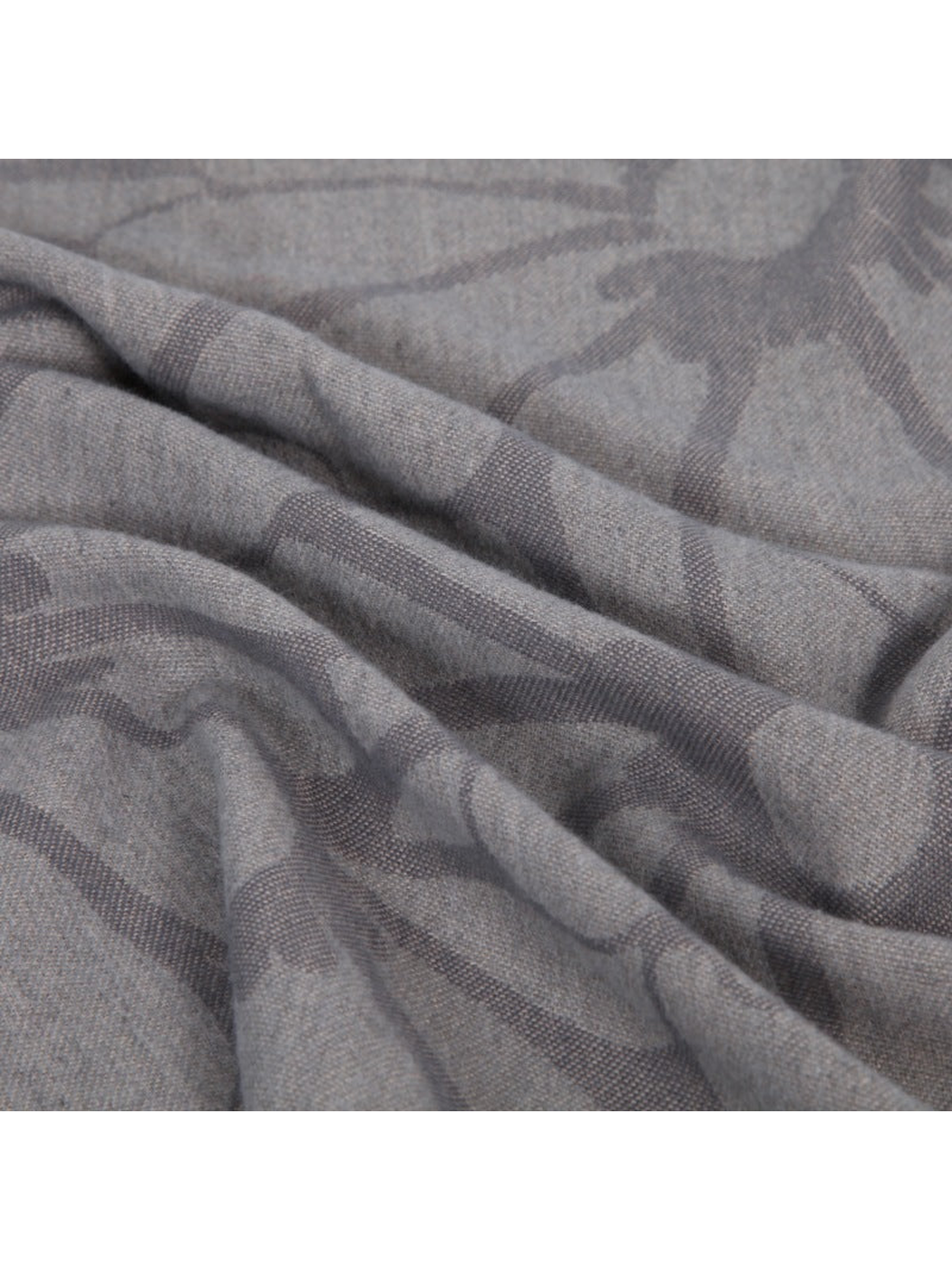 Close-up of the gray floral scarf's fine woven texture and soft folds