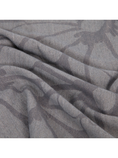 Close-up of the gray floral scarf's fine woven texture and soft folds