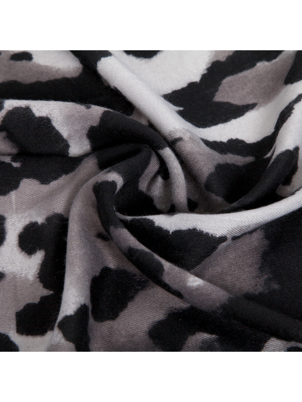 Close-up of the animal-print pattern and fine woven texture
