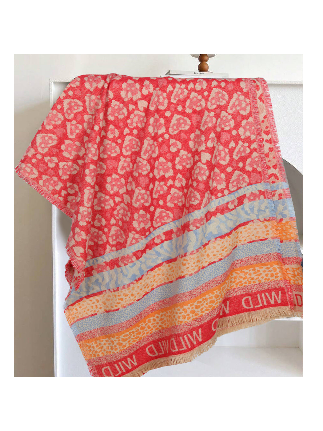 Red rectangular scarf with mixed animal patterns, striped bands and fringed edges