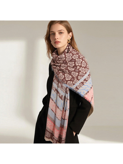 Brown patterned scarf wrapped around the neck and draped broadly over one shoulder