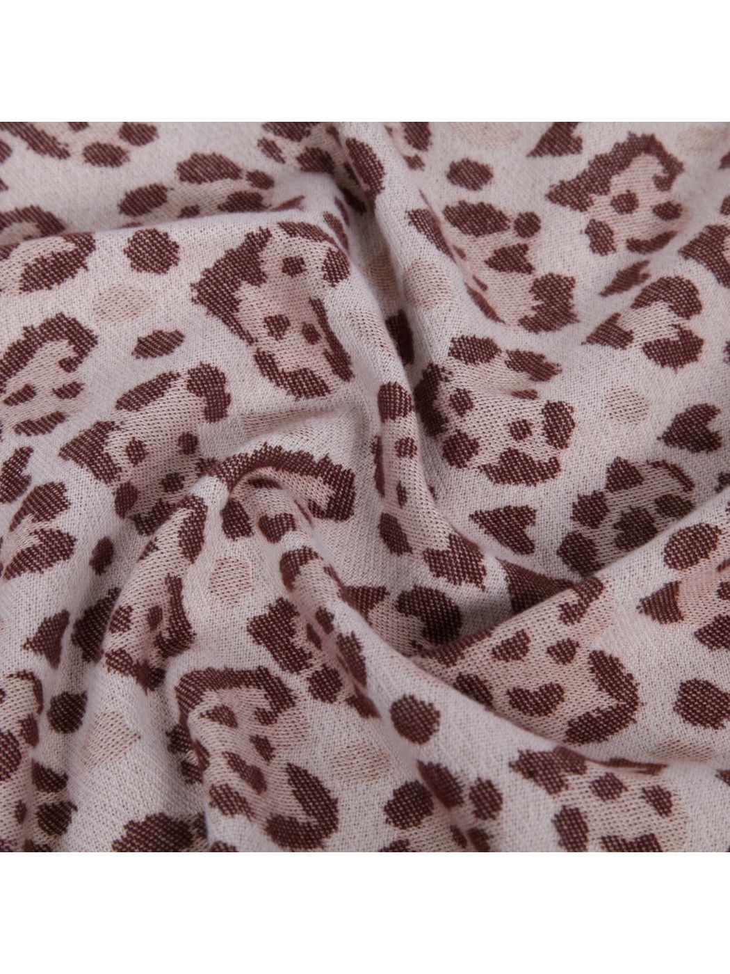 Close-up of the scarf's spotted pattern and fine woven texture