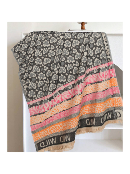 Black and gray rectangular scarf with pink and orange patterned bands and fringed edges