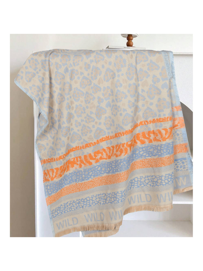 Light blue rectangular scarf with orange patterned bands and fringed edges