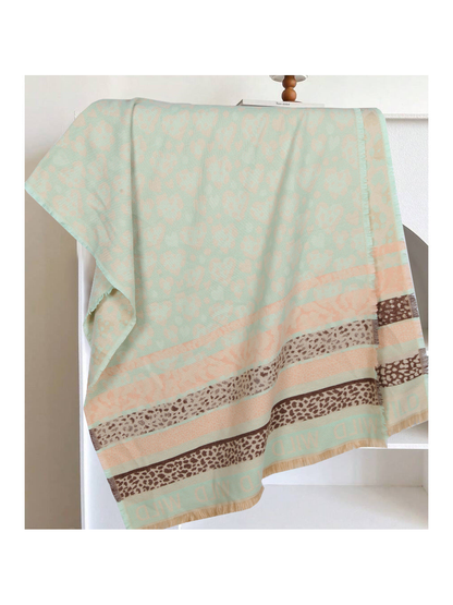 Mint green rectangular scarf with peach and brown patterned bands and fringed edges