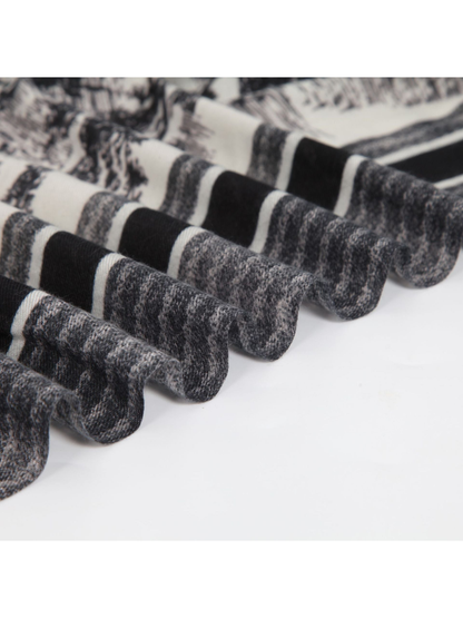 Close-up of the scarf's woven-look texture and striped border