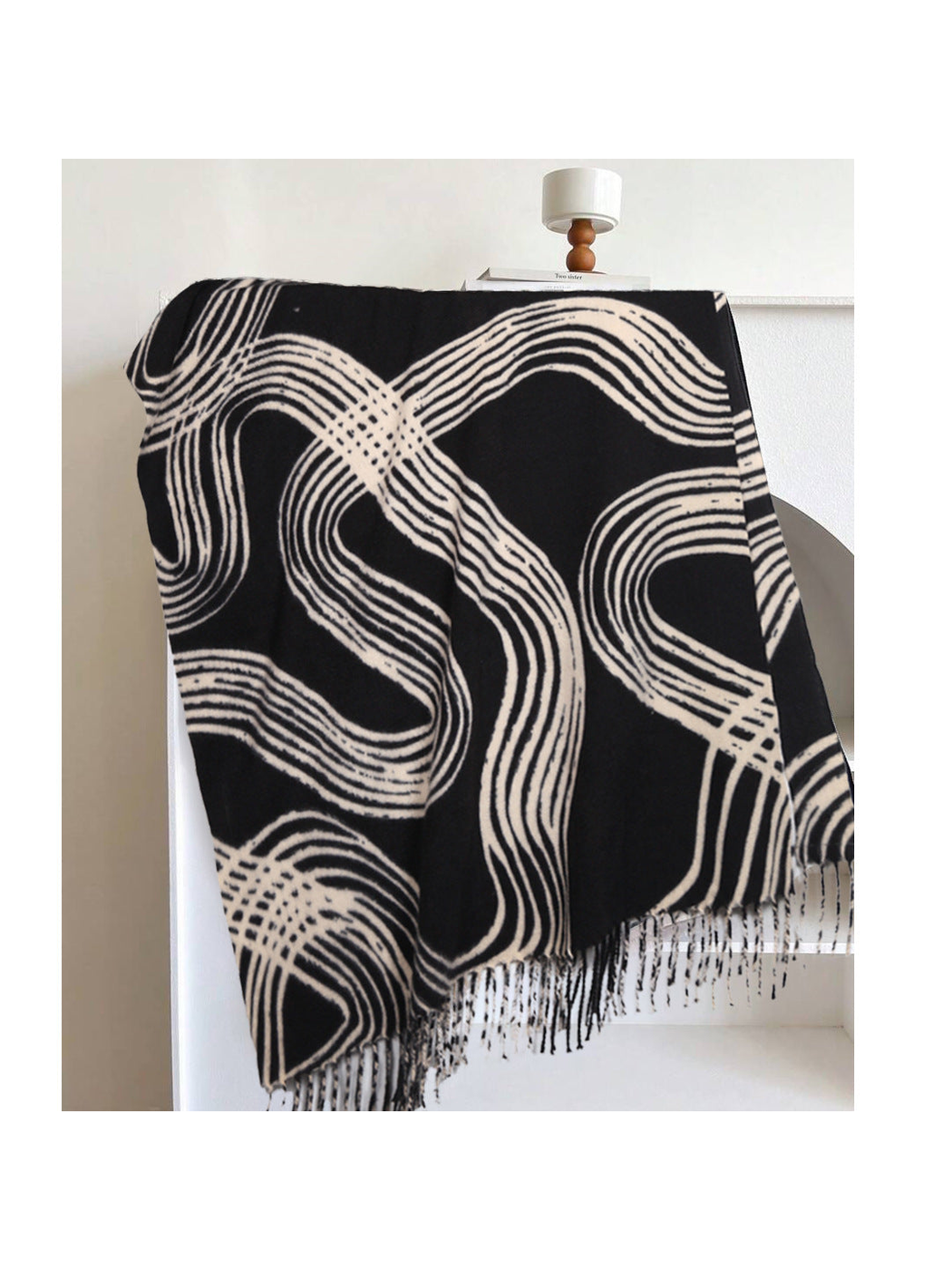Black rectangular scarf with abstract light lines and fringe