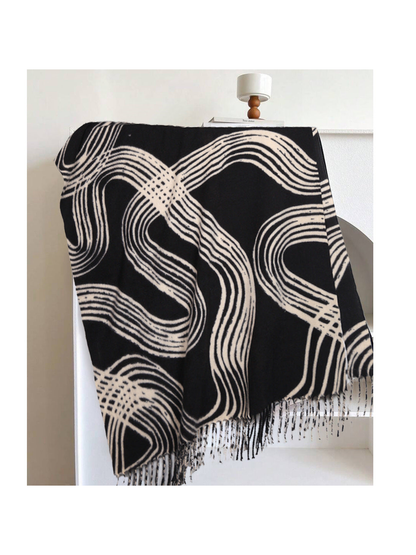Black rectangular scarf with abstract light lines and fringe