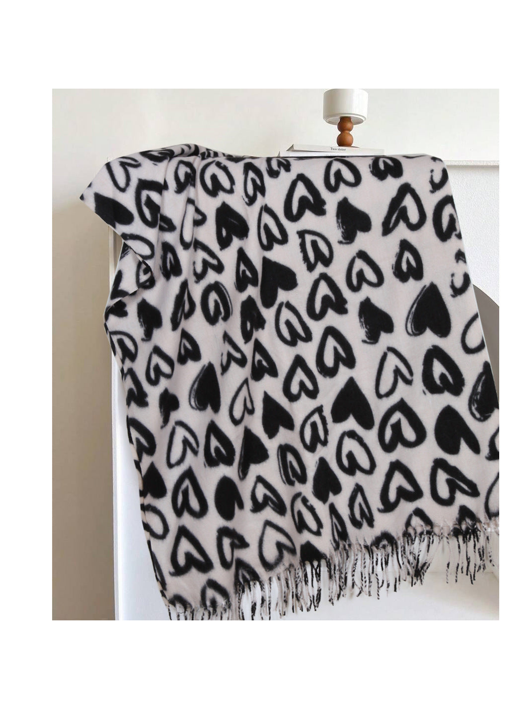 Ivory scarf with black heart pattern and fringed edge