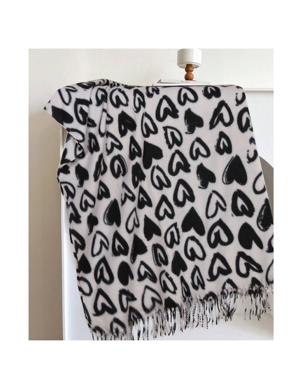Ivory scarf with black heart pattern and fringed edge