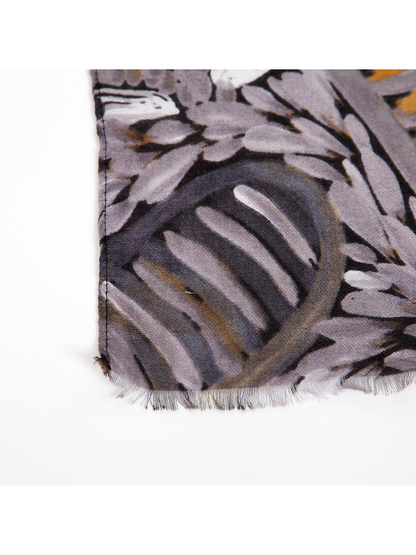 Close-up of the scarf's short fringed edge and printed surface
