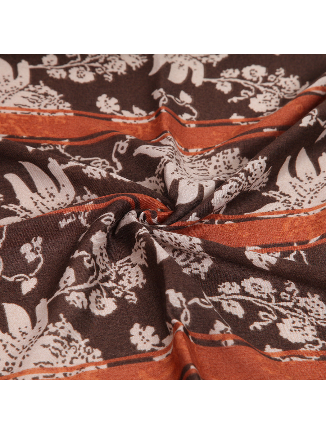 Close-up of the brown floral and animal motif with rust border bands