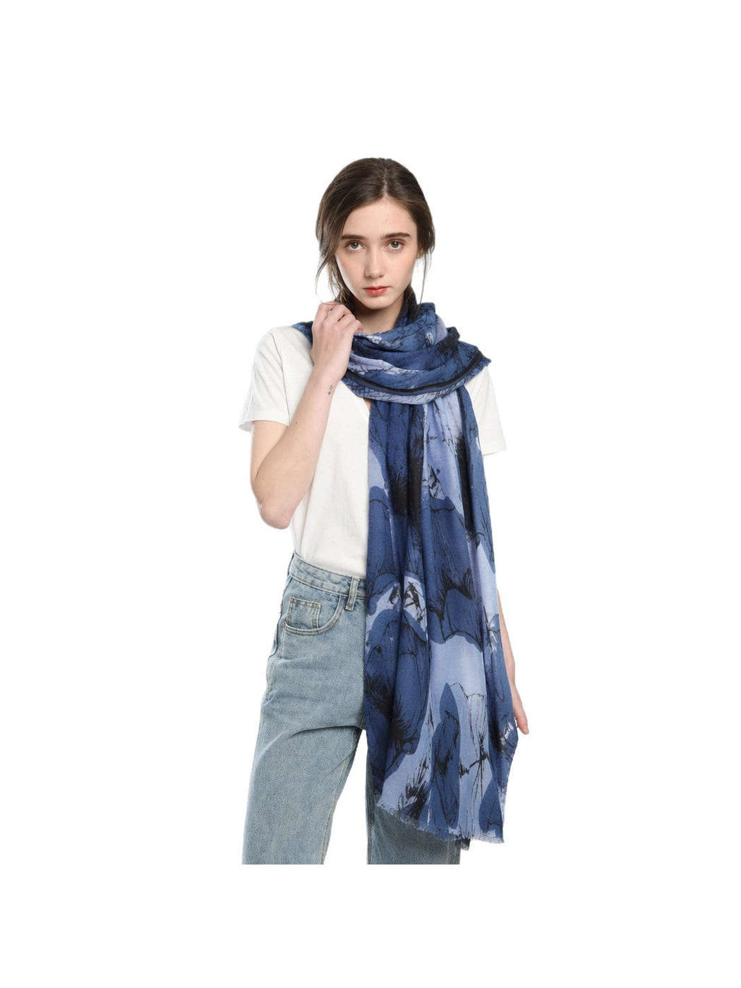 Blue floral scarf wrapped around the neck with both ends hanging down the front