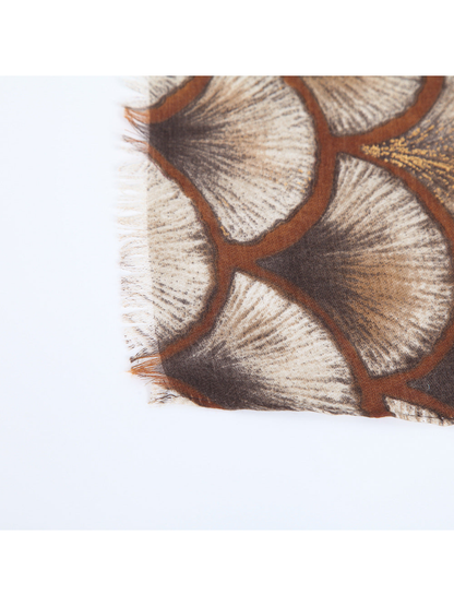 Close-up of the scarf's short fringed edge and printed pattern