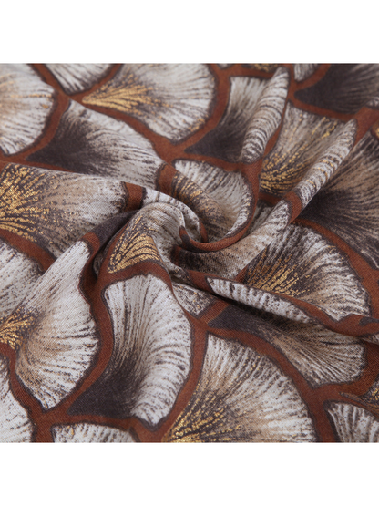 Close-up of the ginkgo-leaf pattern with metallic-look gold accents