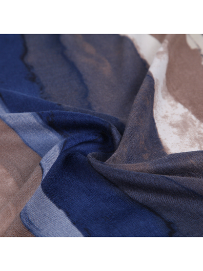 Close-up of blue and brown striped scarf folds and lightly sheer weave